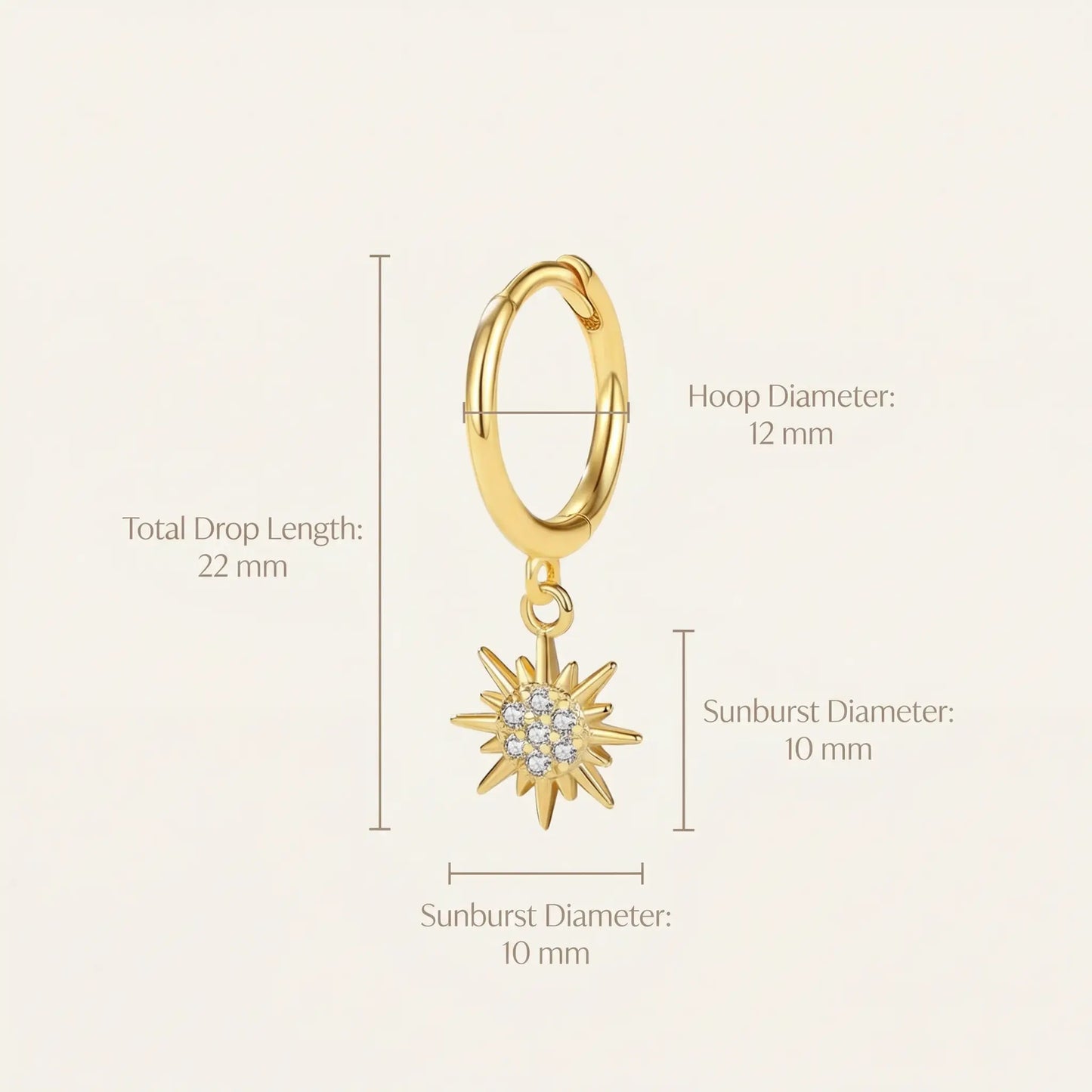 Gold hoop earring with sunburst charm and measurements on a white background
