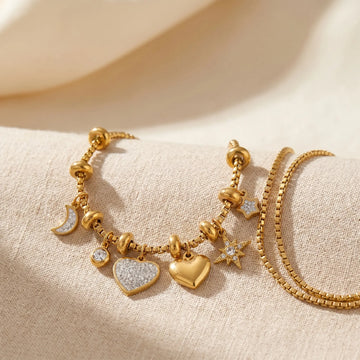 Bracelets collection - gold bracelets styled on a soft beige background