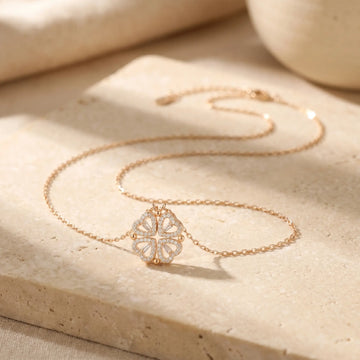 Necklaces collection - delicate gold necklace styled on a soft beige background