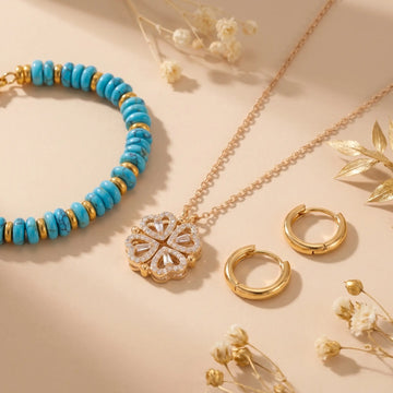 Bestsellers collection - curated gold jewelry flat lay on a soft beige background