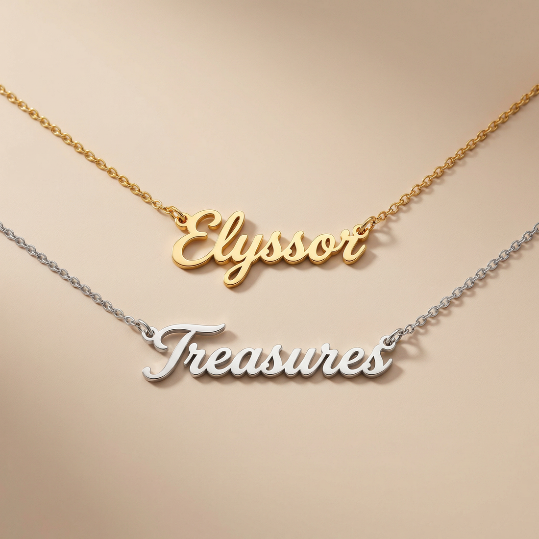 Gold and silver nameplate necklaces on a beige background