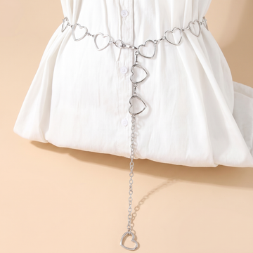 Crystal fringe chain waist belt body chain on a soft beige background