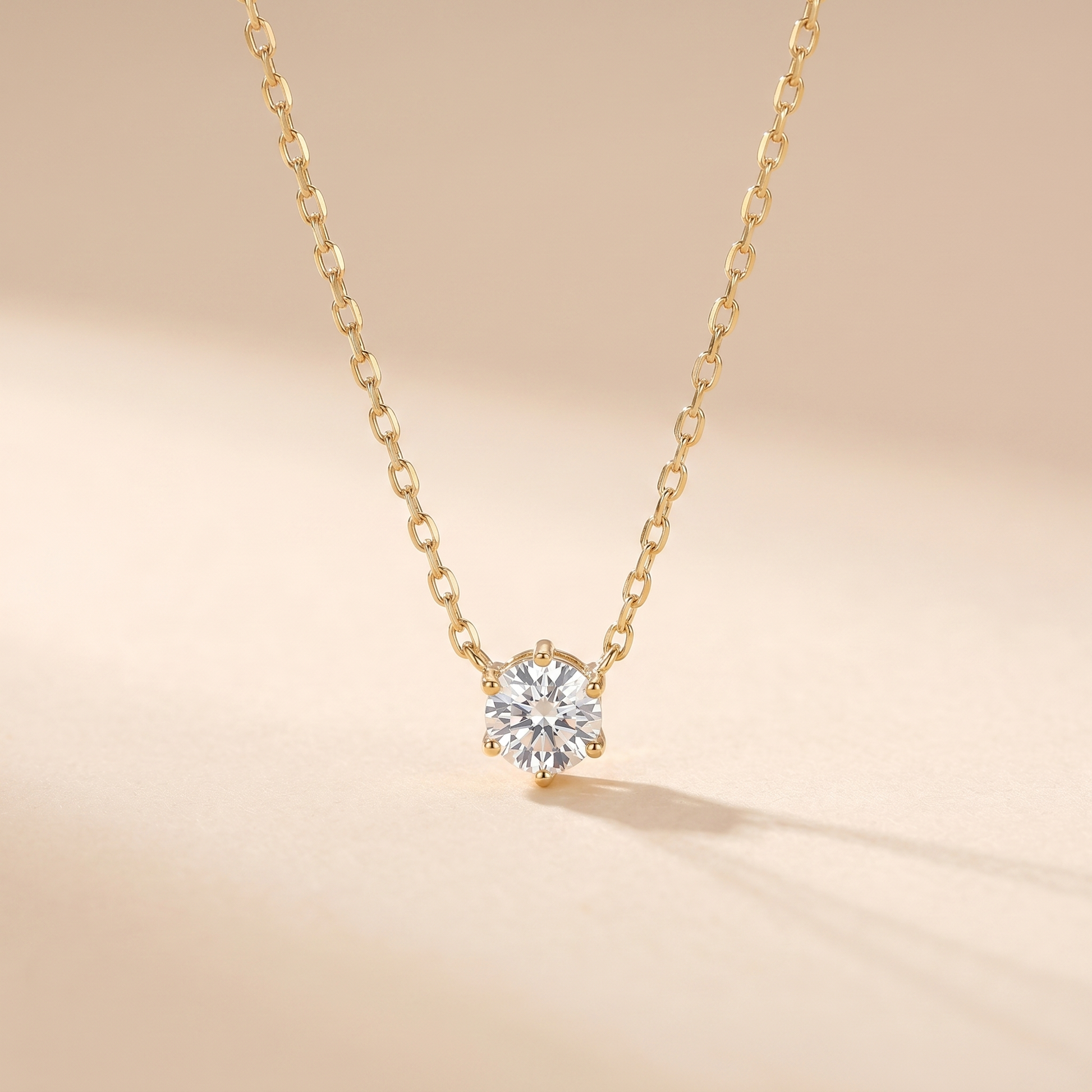 Sterling silver zircon solitaire pendant necklace on a soft beige background