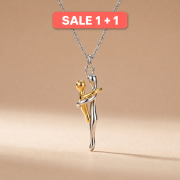Mother and child pendant necklace on a soft beige background with Sale 1+1 badge