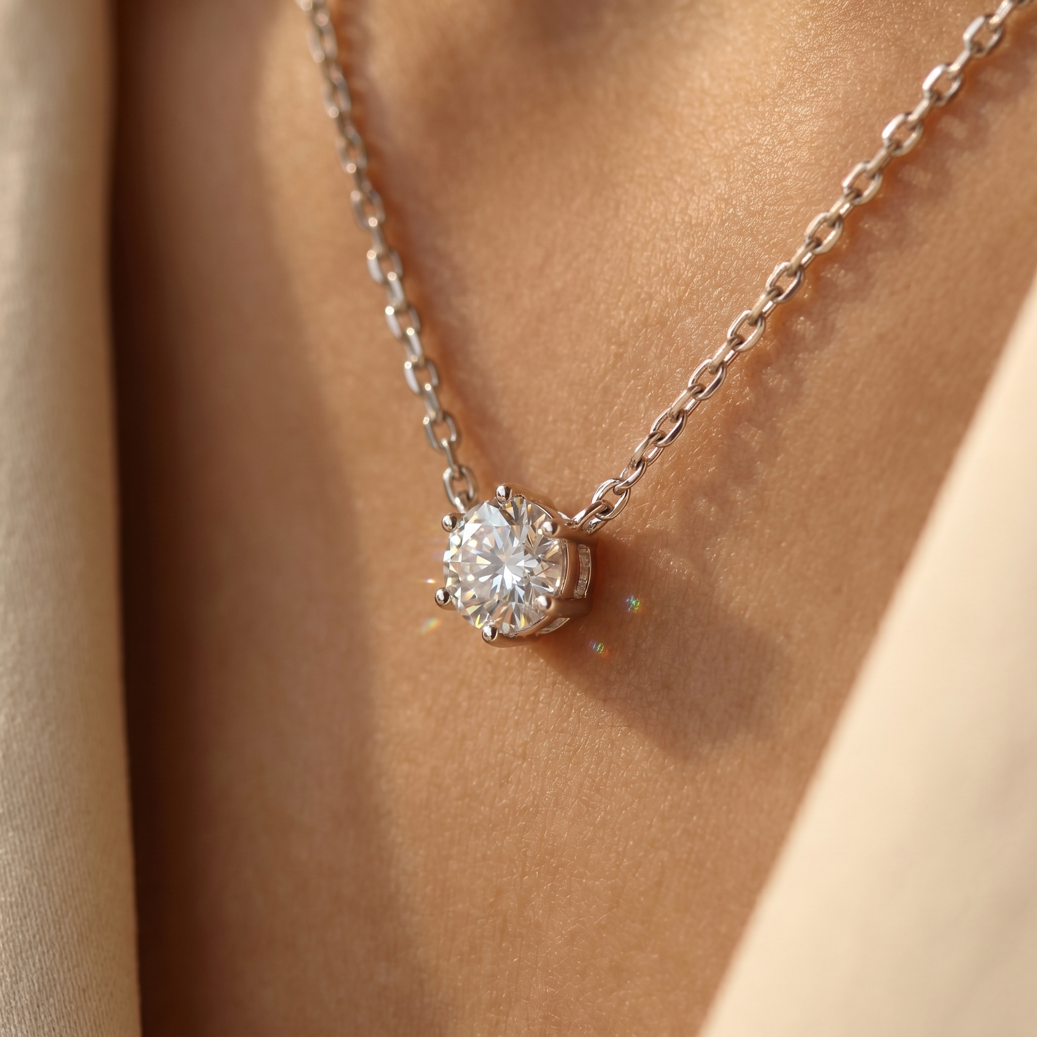 Close-up of the silver zircon solitaire pendant on skin