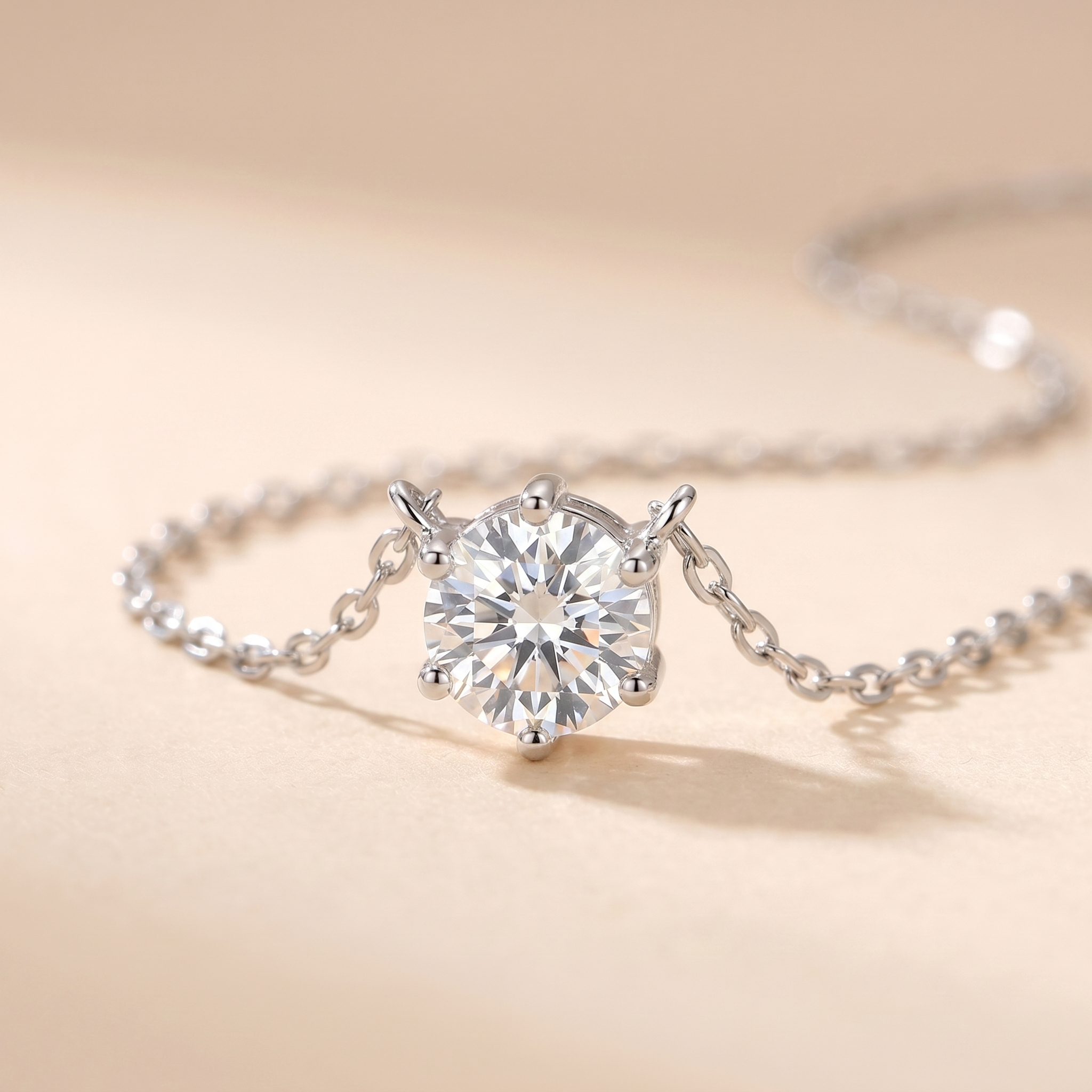Macro detail of the silver zircon solitaire pendant on beige