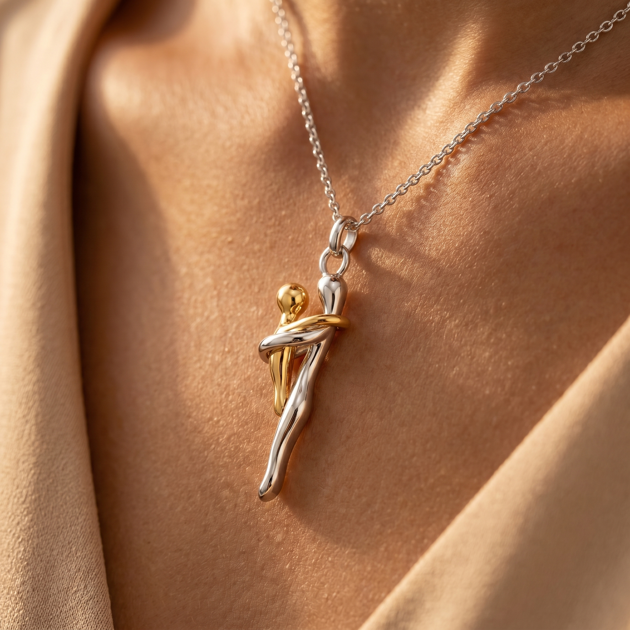 Close-up of the mother and child pendant on skin