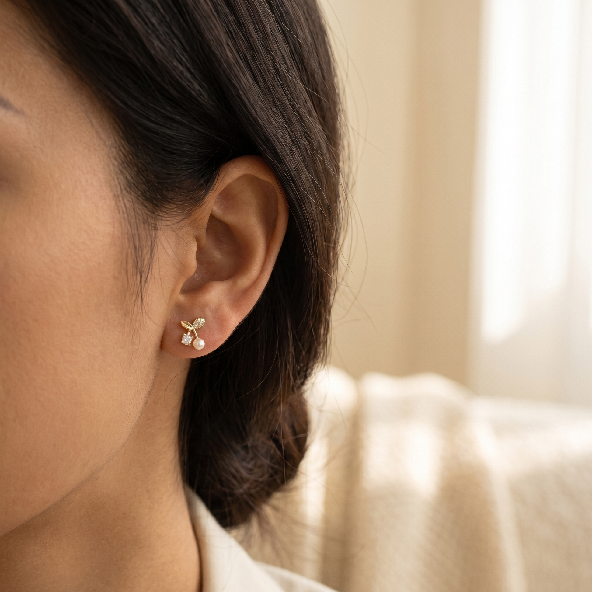 Petite Pearl Sprig Stud Earrings worn on ear