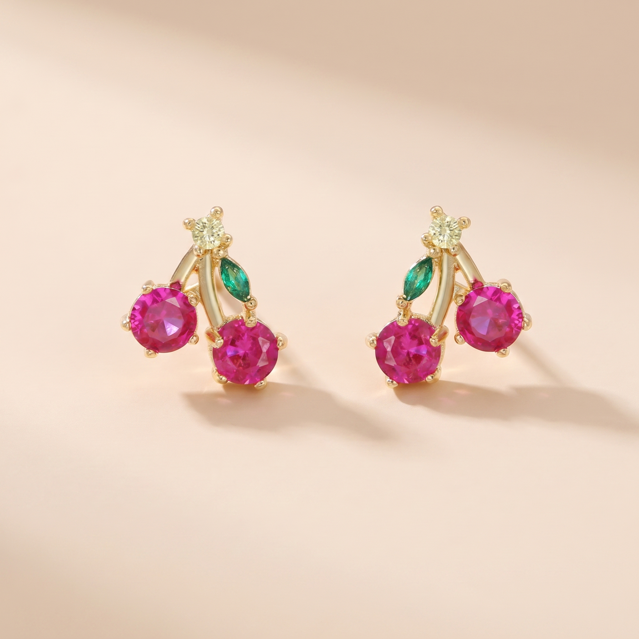 Cherry Sparkle Stud Earrings on soft beige background