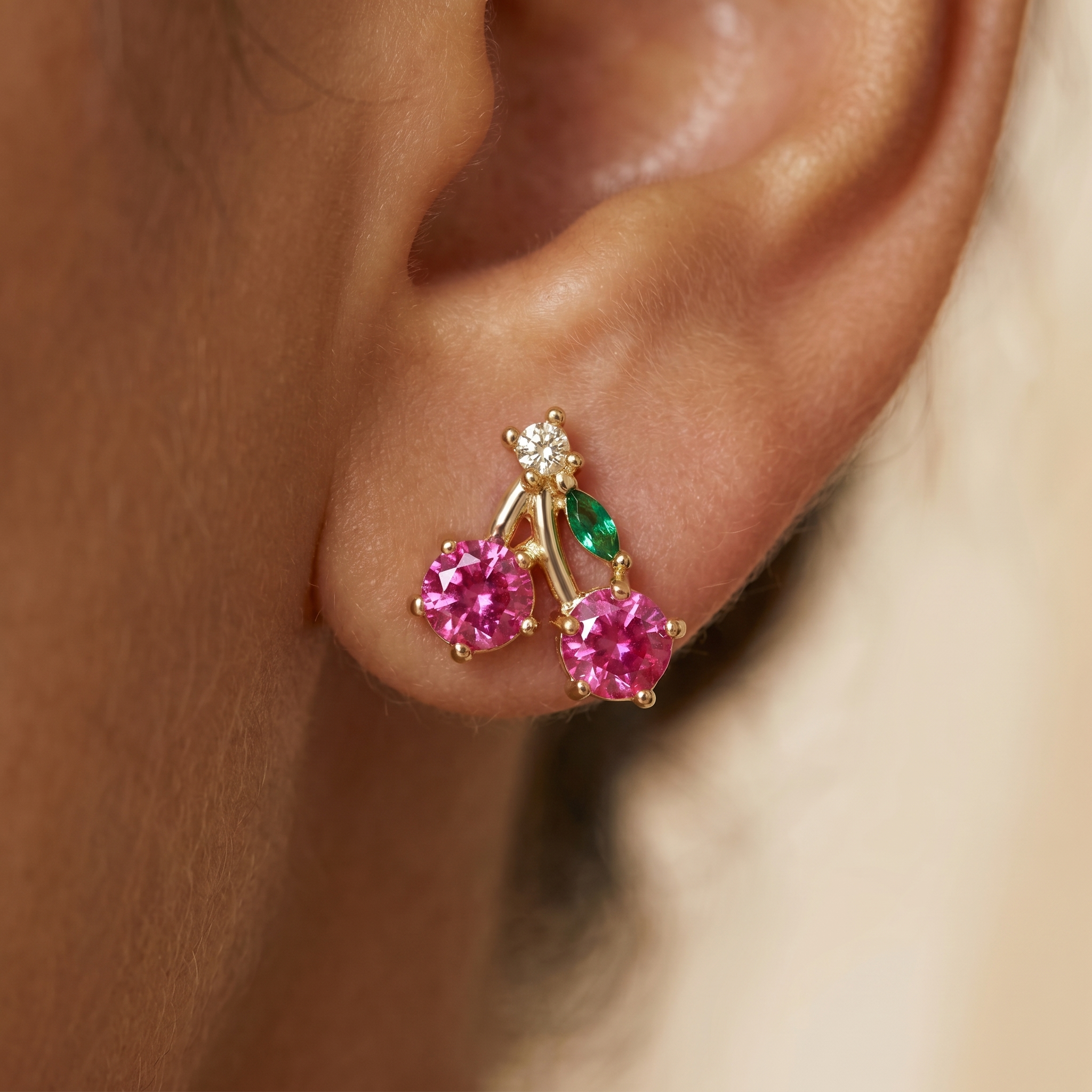 Cherry Sparkle Stud Earrings close-up on ear